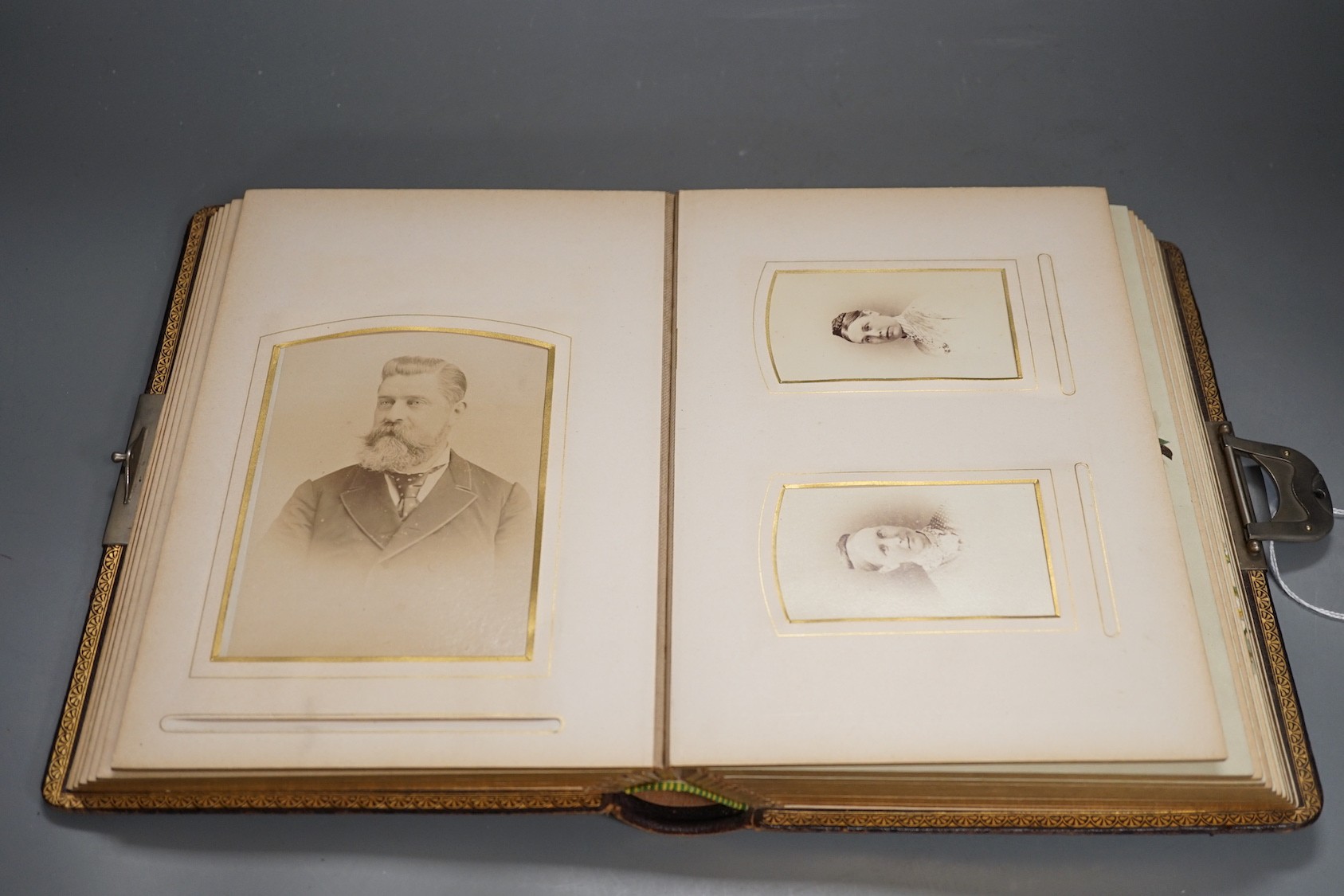 A late Victorian Morocco leather album of cabinet card photo portraits